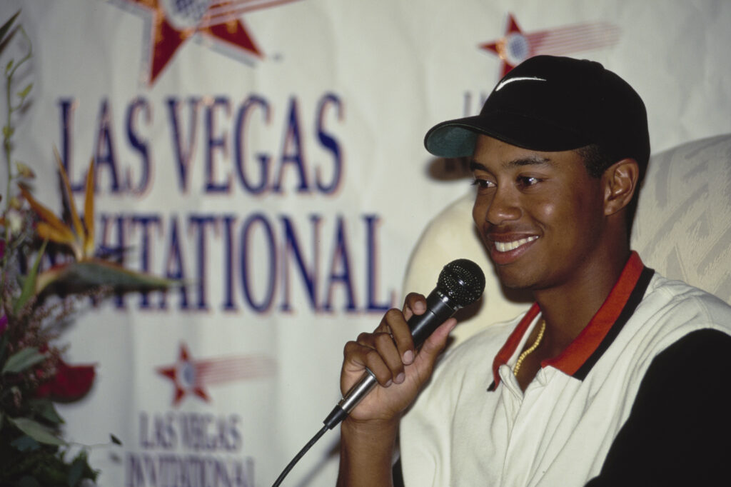 Tiger Woods speaks to the media after winning his first PGA TOUR event at the Las Vegas Invitational in 1996
