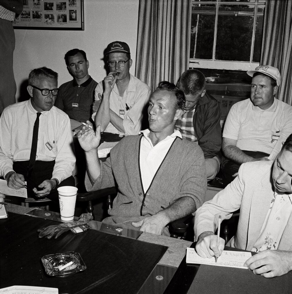 Arnold Palmer speaks with the media after winning the 1958 Masters