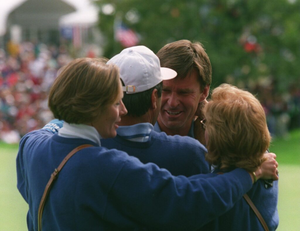 Nick Faldo hugs Seve Ballesteros after winning his singles match against Curtis Strange in the 1995 Ryder Cup at Oak HillRYDER CUP FALDO
